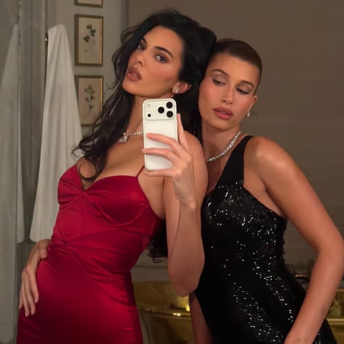 Hailey Bieber and Kendall Jenner wear diamond tennis necklaces and diamond earrings. 
