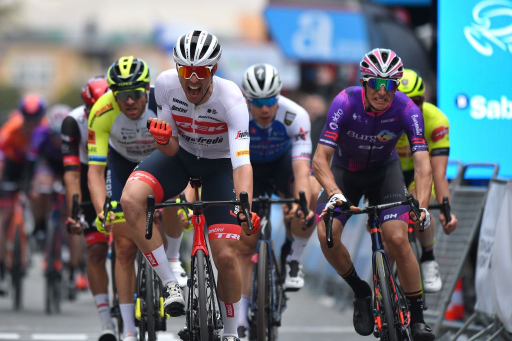 TORREVIEJA SPAIN FEBRUARY 05 Matteo Moschetti of Italy and Team Trek Segafredo celebrates winning ahead of Manuel Penalver Aniorte of Spain and Team Burgos BH and Alexander Kristoff of Norway and Team Intermarch Wanty Gobert Matriaux during the 73rd Volta A La Comunitat Valenciana 2022 Stage 4 a 1931km stage from Orihuela to Torrevieja VCV2022 on February 05 2022 in Torrevieja Spain Photo by Dario BelingheriGetty Images