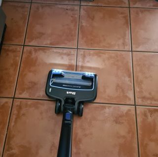 Shark IZ300UK Anti Hair Wrap Cordless Stick Vacuum Cleaner on hard tiled floor