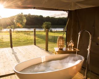 bath in safari tent at accomodation Pinkfoot, in Lincolnshire, via Canopy & Stars