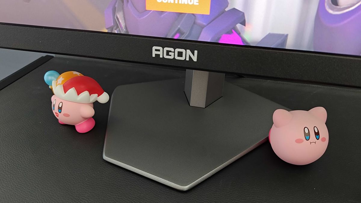 AOC AGON Pro AG246FK stand next to Kirby figures