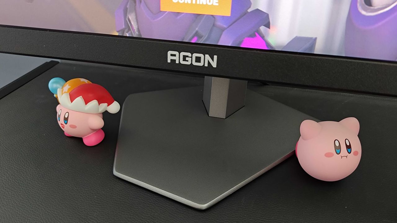 AOC AGON Pro AG246FK stand next to Kirby figures