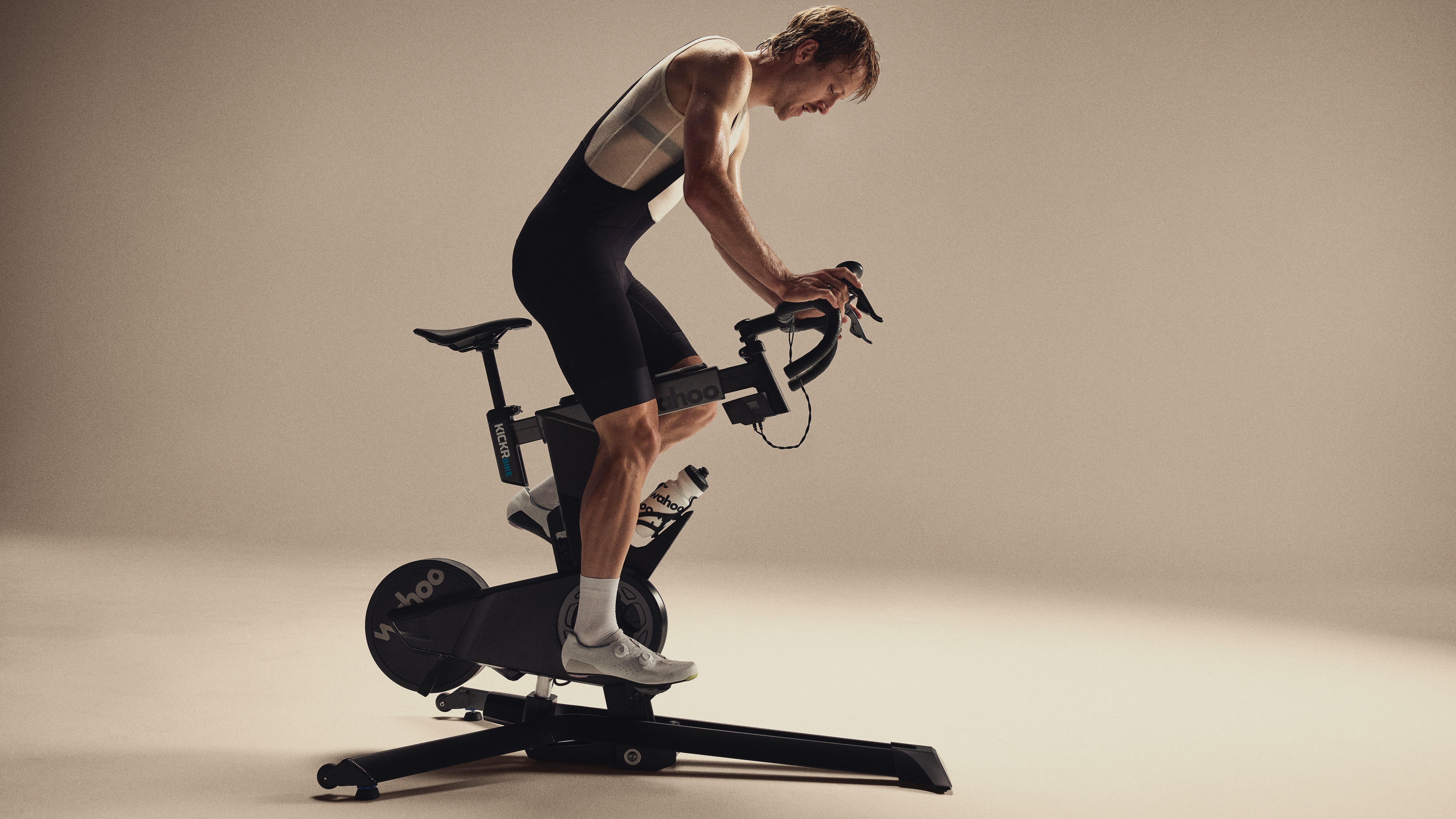 A man riding a Wahoo Kickr Bike Pro