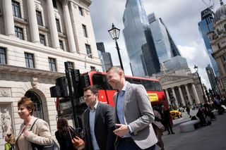 People walk past the Bank of England in the City of London (Photo by Richard Baker / In Pictures via Getty Images)