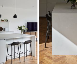 A side-image of a white kitchen island with wooden panelled flooring