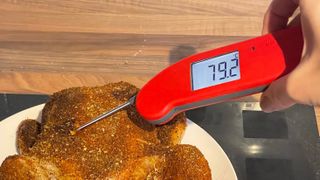 The ThermoWorks Thermapen One being used to test the temperature of Chicken