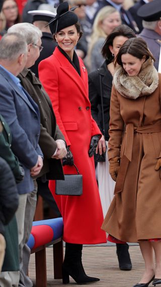 kate middleton in red dress and black boots