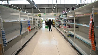 Empty shelves at a Manchester supermarket in March 