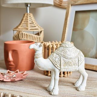 living room with little camel ornament and frame