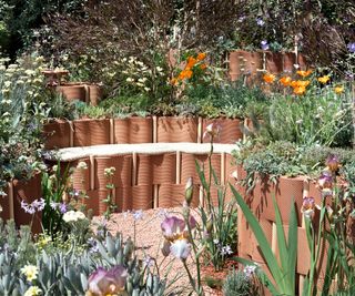 circular raised beds made from perforated clay