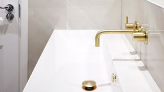 long contemporary basin with brass tap