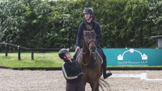 Jack Whitaker riding Jagerbomb, with Becky Moody standing
