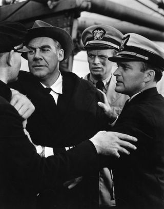 several soldiers and a man have a confrontation in the movie Panic in the Streets