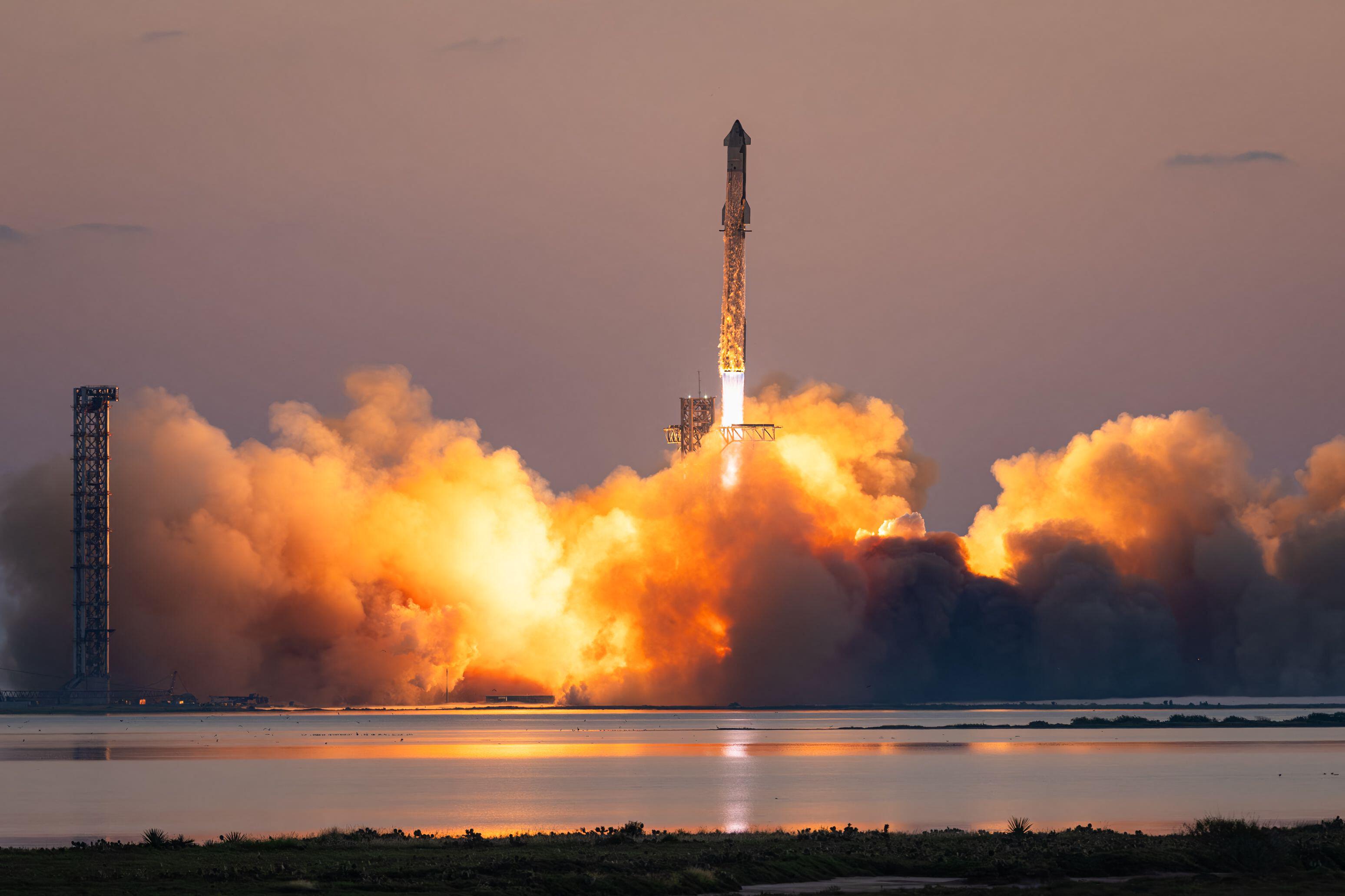 Rocket ship taking off surrounded by smoke and flames