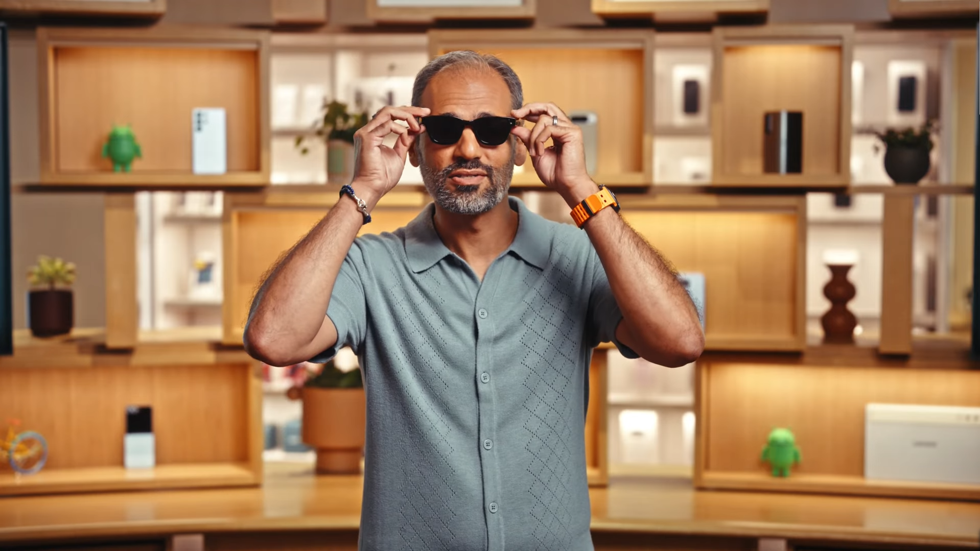 Android Ecosystem President Sameer Samat putting on a pair of mysterious smart glasses during an Android Show livestream