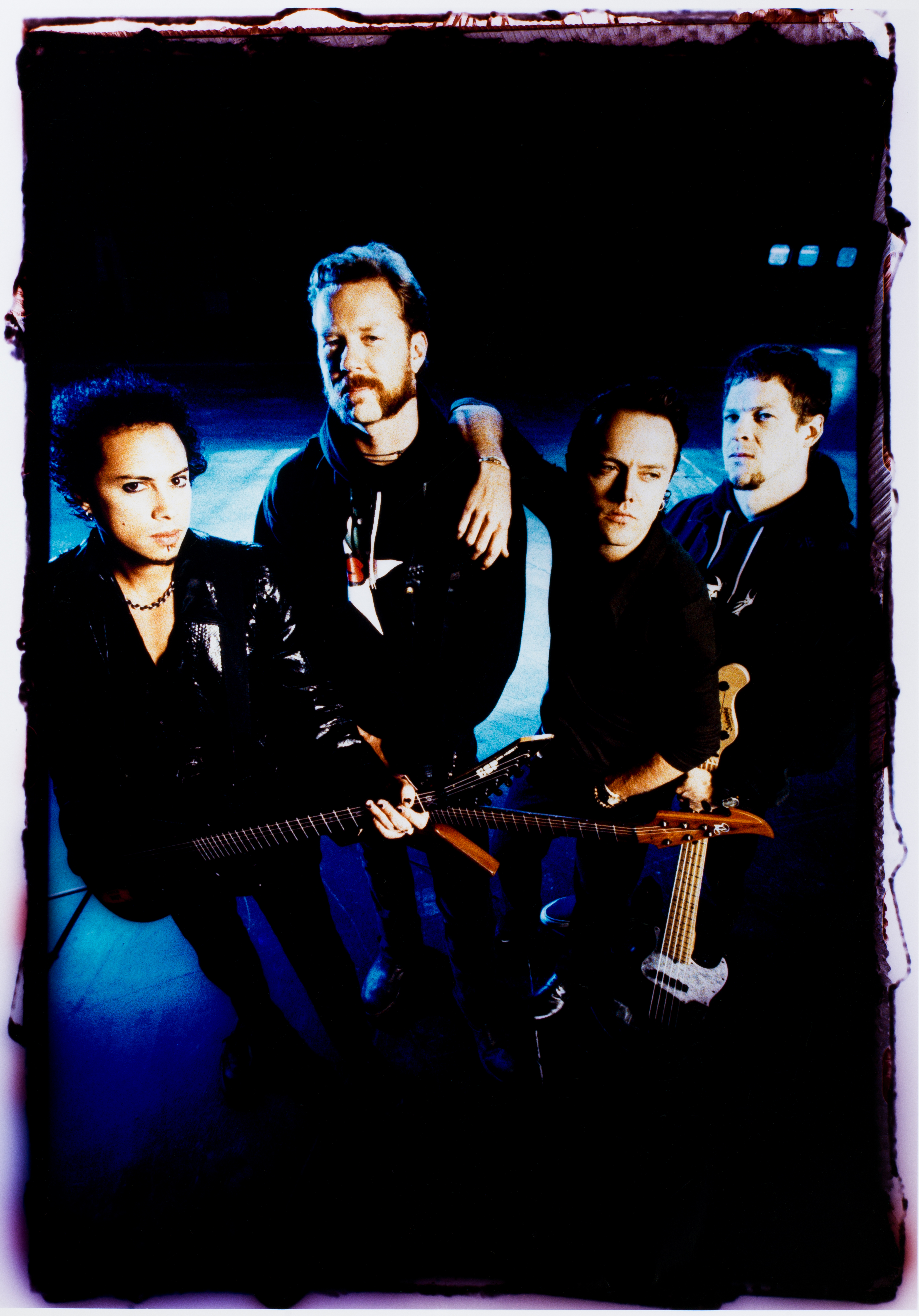Metallica posing backstage at a show in 1996