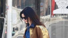 Anne Hathaway rocks metallic jacket and jeans during stroll in Downtown NYC 28/04/2025
