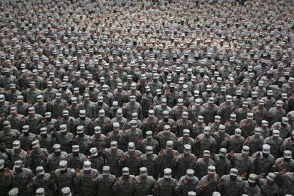 U.S. soldiers take an oath during a mass reenlistment ceremony in Baghdad in 2008.