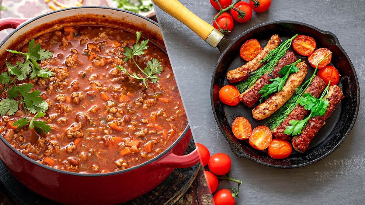 Dutch oven with chilli and cast iron skillet cooking sausages