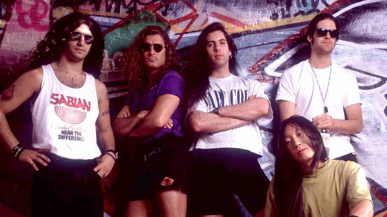Dream Theater posing for a photograph in front of a graffiti&amp;rsquo;d wall in 1992