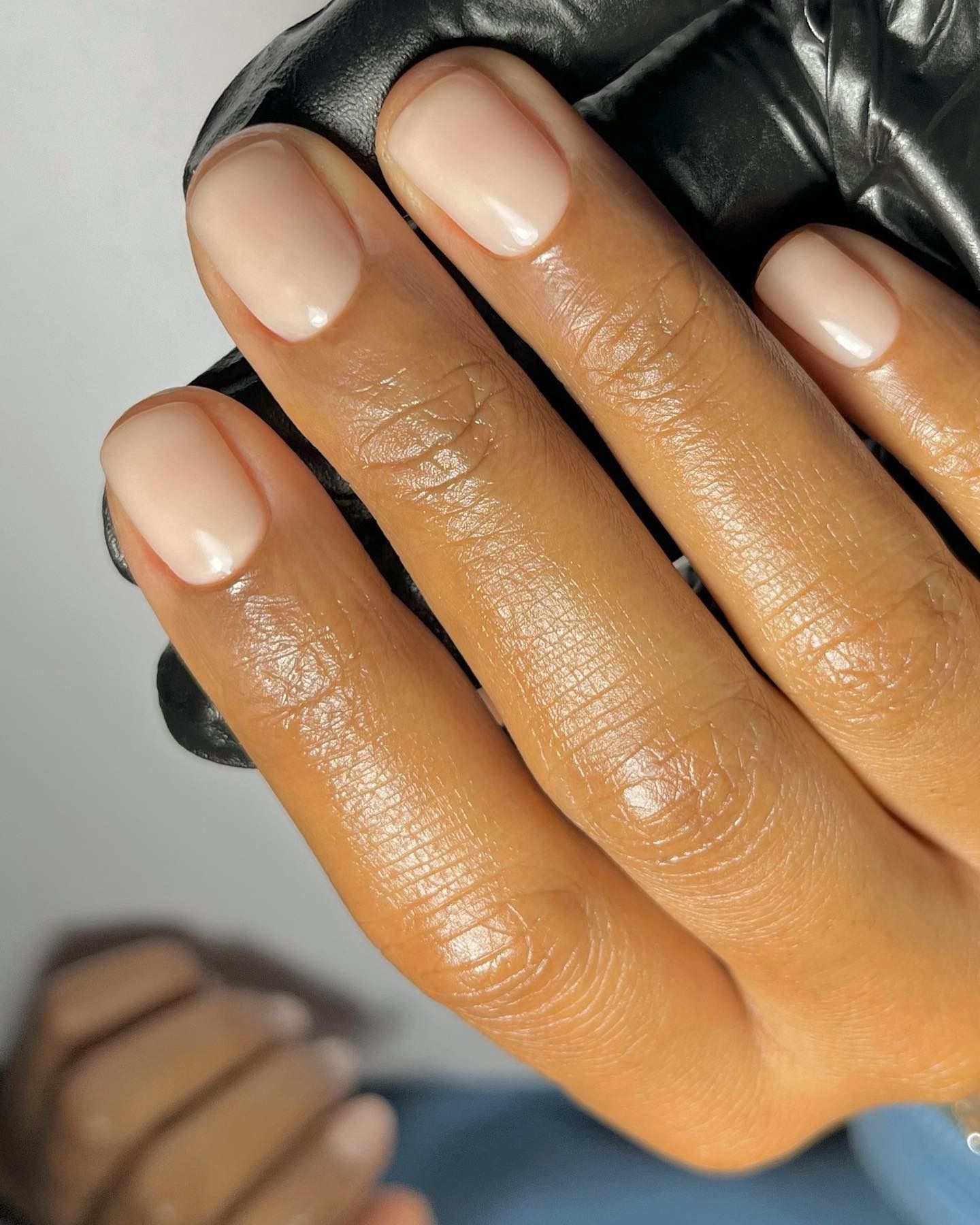 A waxy nude manicure.