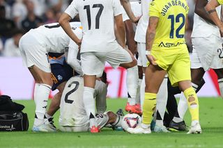 Real Madrid's Dani Carvajal grimaces in pain after suffering a serious injury in a LaLiga game against Villarreal in October 2024.