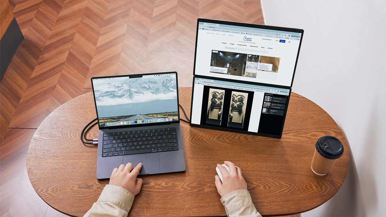 The JSAUX FlipGo Horizon on a table with the two accessory monitors stacked on top of each other.
