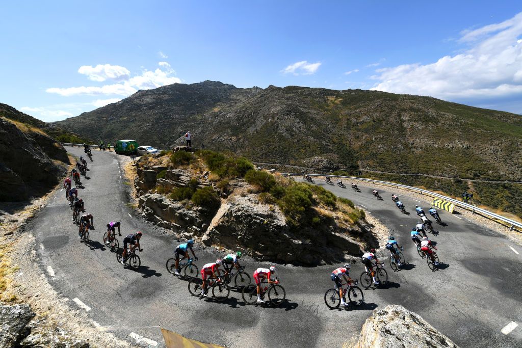 EL BARRACO SPAIN AUGUST 29 A general view of Guillaume Martin of France and Team Cofidis Giulio Ciccone of Italy and Team Trek Segafredo David De La Cruz Melgarejo of Spain and UAE Team Emirates Aleksander Vlasov of Russia and Team Astana Premier Tech and the peloton pass through Puerto de Pedro Bernardo 1226m during the 76th Tour of Spain 2021 Stage 15 a 1975km km stage from Navalmoral de la Mata to El Barraco lavuelta LaVuelta21 on August 29 2021 in El Barraco Spain Photo by Tim de WaeleGetty Images