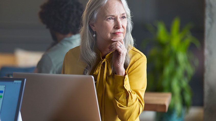 senior woman looking at laptop