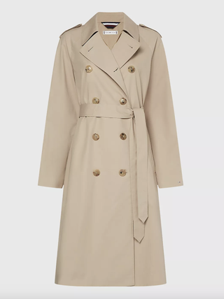 a tommy hilfiger trench coat on a plain backdrop