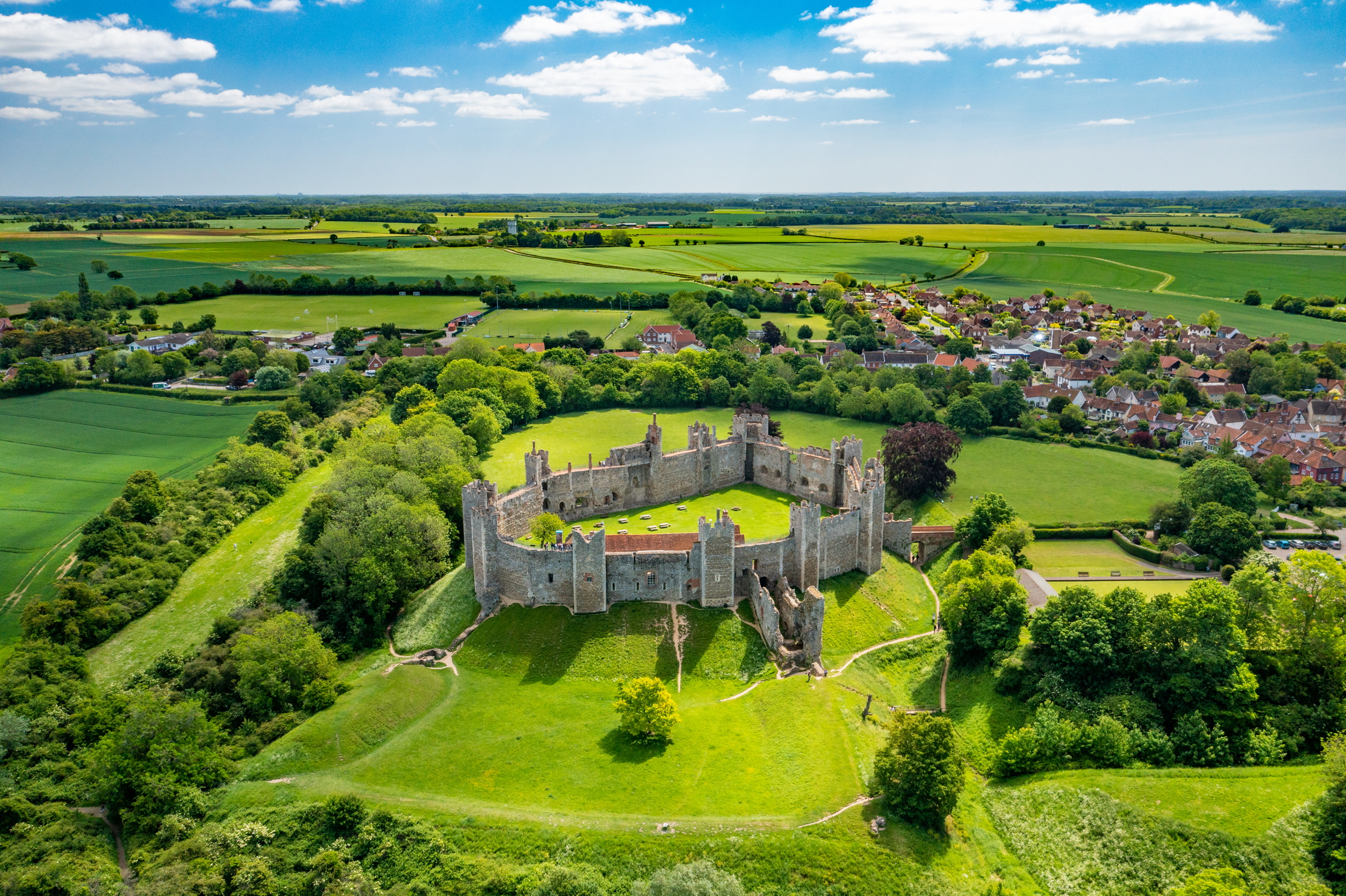 Framlingham Castle is a castle in the market town of Framlingham in Suffolk in England. An early motte and bailey or ringwork Norman castle was built on the Framlingham site by 1148, but this was destroyed by Henry II of England in the aftermath of the Revolt of 1173&amp;ndash;1174. Also know for being the 'Castle on the Hill' that Ed Sheeran sings about.