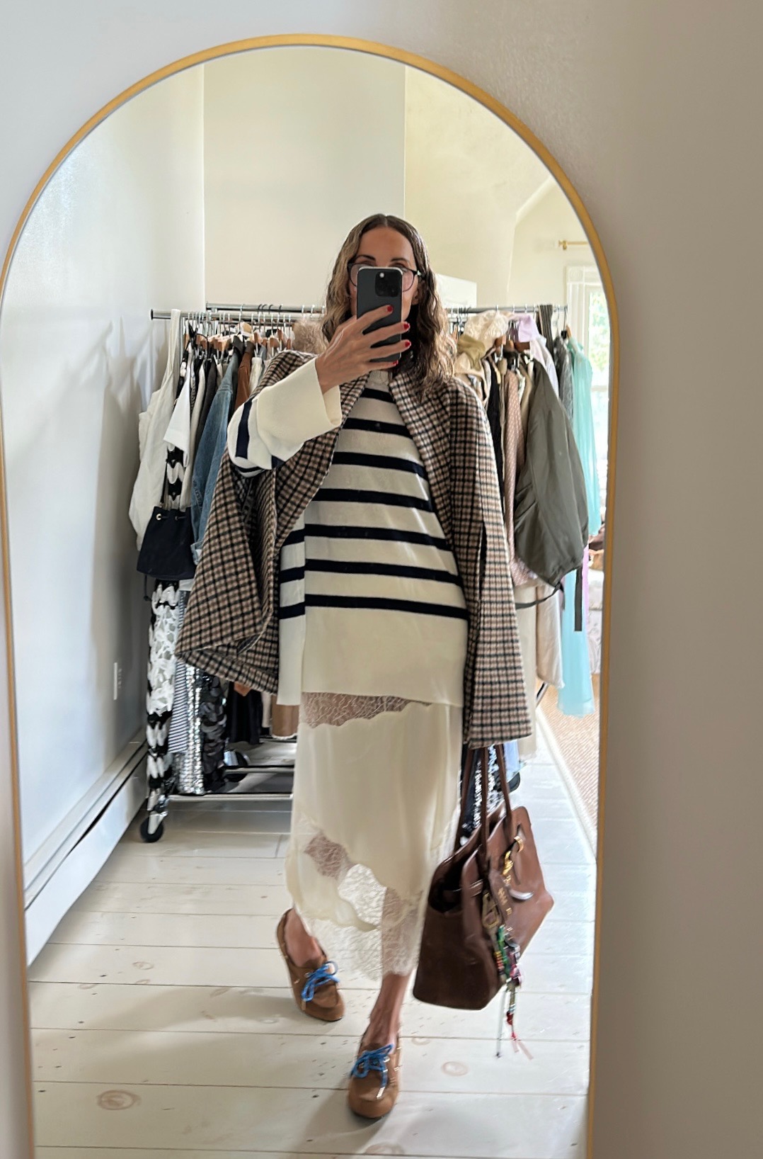 a photo of fashion content creator Larissa Mills wearing trendy shoes and glasses