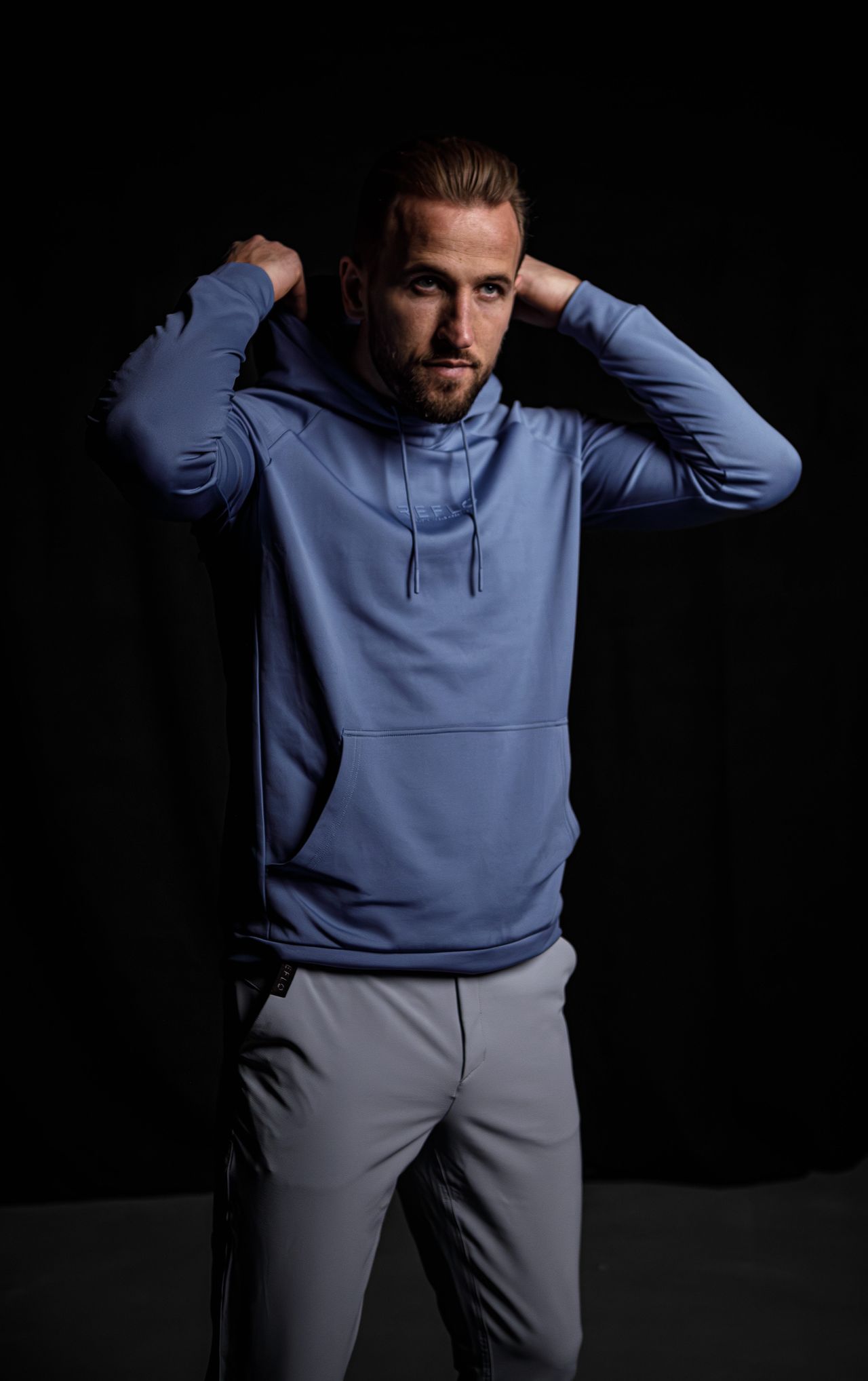 Harry Kane in the Reflo Lapter golf hoodie