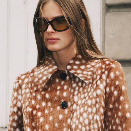 Woman wearing Bambi jacket and sunglasses