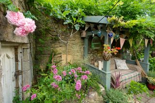 Garden in Bath with roses around a covered seating area