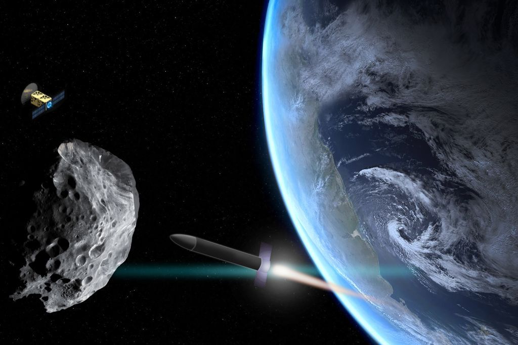 An illustration shows a rocket approaching an asteroid that&#039;s drifted too close to Earth. A scout probe orbits nearby.