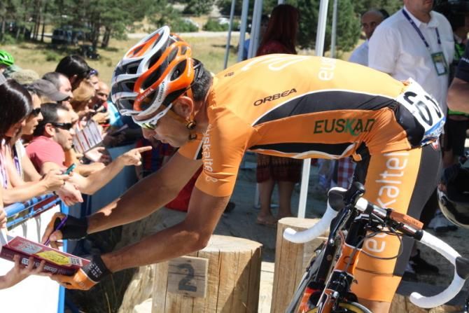 An Euskaltel rider signs autographs