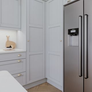 Minimalist kitchen with a large silver fridge