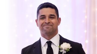 Nick Torres smiling in tux during fake wedding in NCIS Season 22