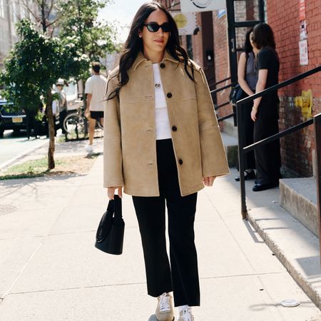 nicole eshaghpour outfit photo in beige suede jacket and sneakers