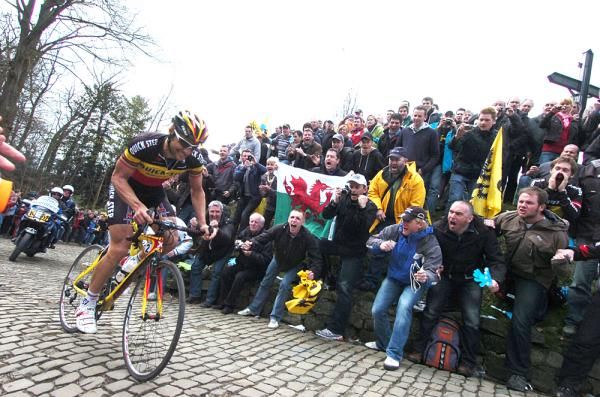 Boonen rides to the top of the Kapelmuur about 10 seconds behind Cancellara.