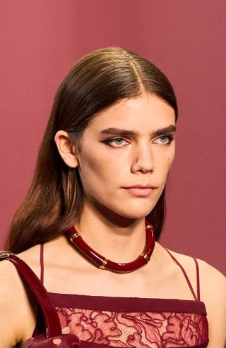 model wearing red necklace on gucci spring 2025 runway