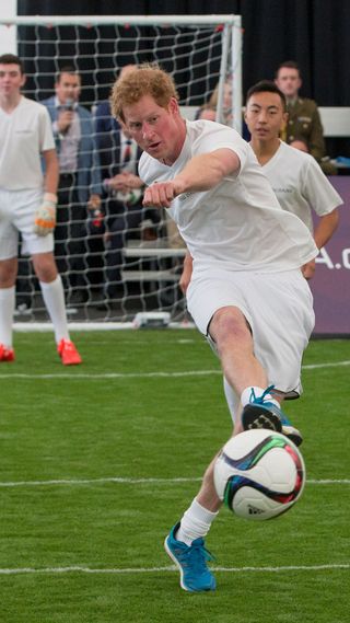 Prince Harry playing football