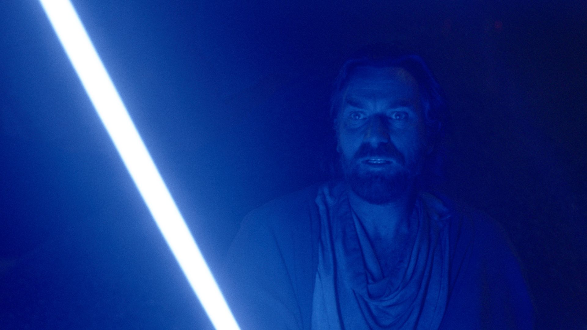 Obi-Wan Kenobi holding his blue lightsaber