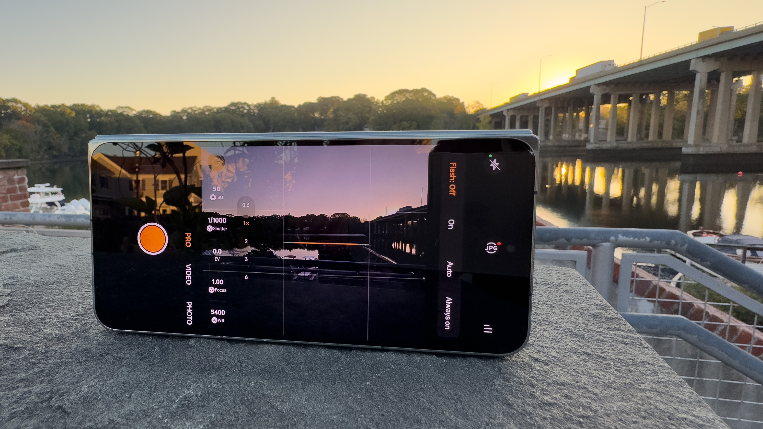 OnePlus Open with camera app open pointed at bridge during sunrise