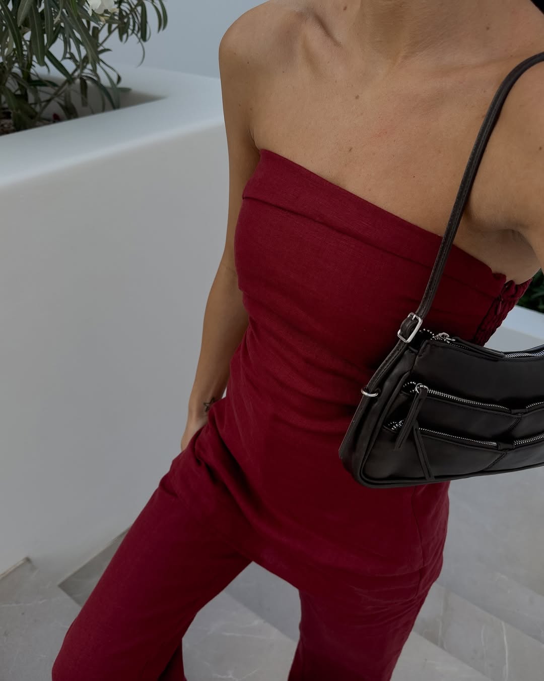 @_jessicaskye wearing a strapless red linen top