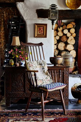 wooden chair by the fireplace