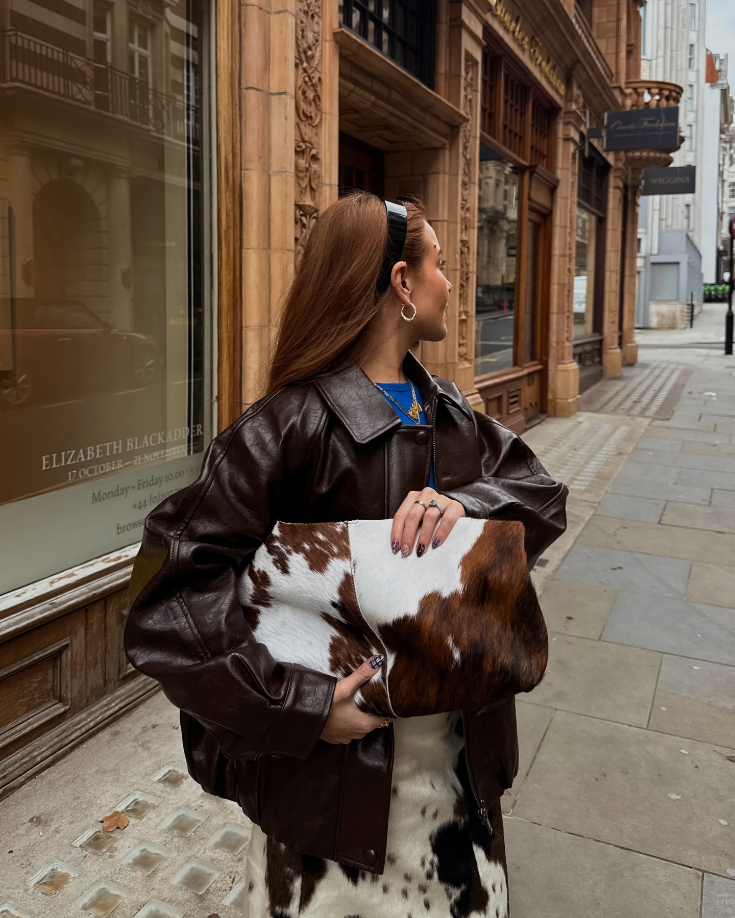 An image of @rebeccaferrazwyatt wearing the cow print trend, one of the biggest animal print trends for 2026.