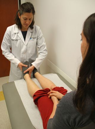 Dr. Anastasia Fischer checks the bones of a patient's ankle at Nationwide Children's Hospital in Columbus, Ohio. Fischer says a growing number of young women are being diagnosed with female athlete triad syndrome. The condition causes weakened bones, a disruption in a woman's menstrual cycle and low energy, due to a lack of calorie consumption.