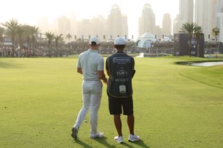 McIlroy and caddie discuss the shot